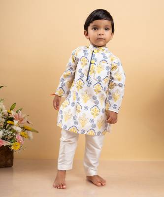 Vibrant floral printed kurta paired with classic white pants 4