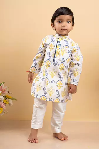 Vibrant floral printed kurta paired with classic white pants