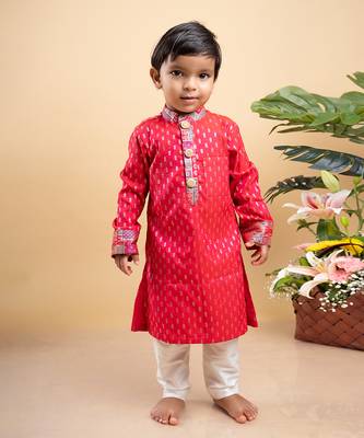 Elegant red kurta with golden embroidery paired with classic white pants 1