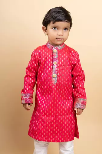 Elegant red kurta with golden embroidery paired with classic white pants