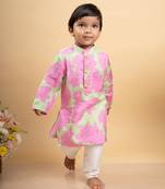 Vibrant pink and green tie-dye kurta paired with classic white pants