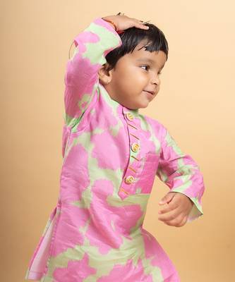 Vibrant pink and green tie-dye kurta paired with classic white pants 2