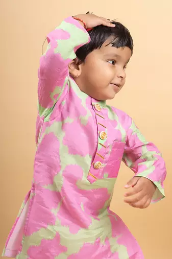 Vibrant pink and green tie-dye kurta paired with classic white pants