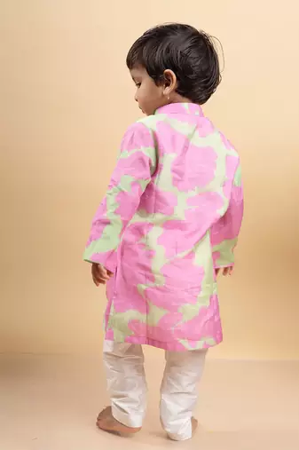Vibrant pink and green tie-dye kurta paired with classic white pants