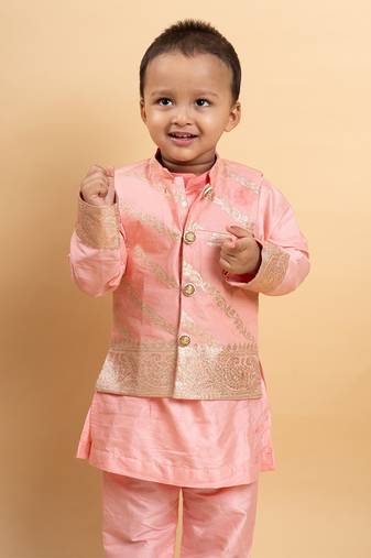 Elegant soft peach kurta set with a regal golden-detailed jacket