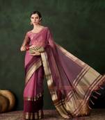 Wine cotton-silk saree with gold zari border.