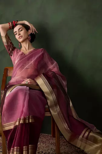 Wine cotton-silk saree with gold zari border.