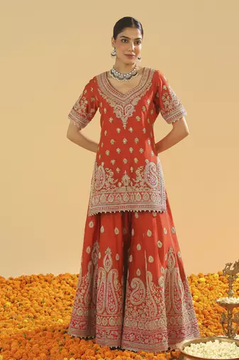 Shazfa burnt orange short kurta with sharara and dupatta