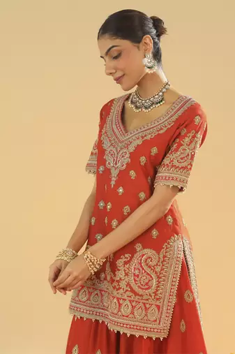 Shazfa burnt orange short kurta with sharara and dupatta