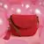 red polyester  sling bag with tassel charm design