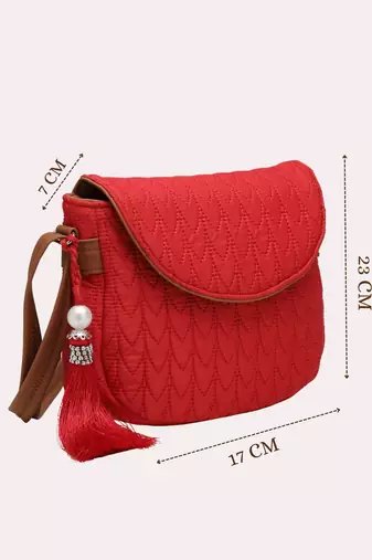 red polyester  sling bag with tassel charm design