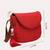 red polyester  sling bag with tassel charm design