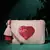 multi cotton canvas sling bag with jacquard heart