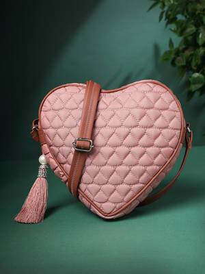 dusty pink polyester sling bag with chevron quilting 1