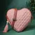 dusty pink polyester sling bag with chevron quilting