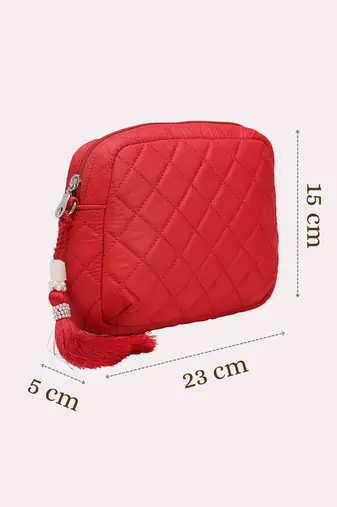 red polyester sling bag with diamond quilting