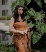 Orange simmer tissue golden saree with golden handwork lace & blouse piece