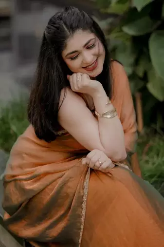 Orange simmer tissue golden saree with golden handwork lace & blouse piece