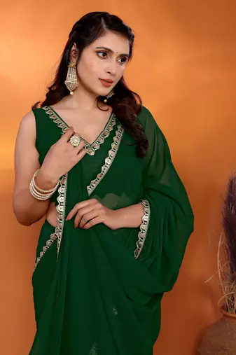 Bottle green embellished pure georgette party wear saree with blouse piece