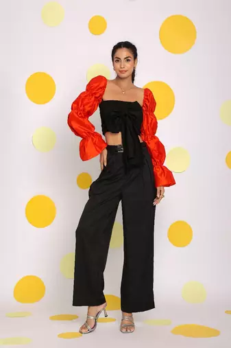 Black and orange statement sleeves top with front tie and pant co-ord set