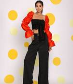 Black and orange statement sleeves top with front tie and pant co-ord set