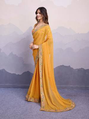 Glamorous yellow embroidered georgette indian designer saree for weddings parties and traditional occasions 6