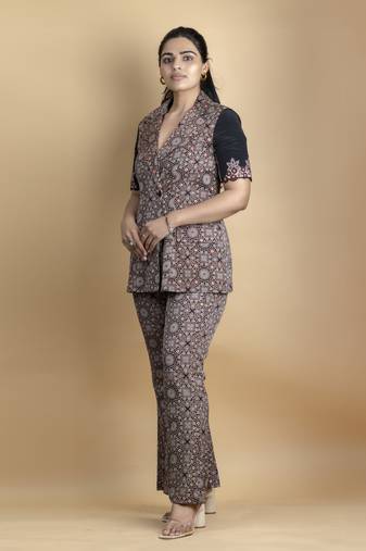 Black co ord set pure ajrakh fabric embellished with fine thread details on sleeves paired with bell bottoms