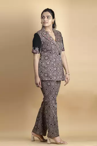 Black co ord set pure ajrakh fabric embellished with fine thread details on sleeves paired with bell bottoms