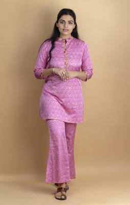 Pink co ord set with hand work embellished top and bell shaped bottoms on pure ajrakh fabric 1