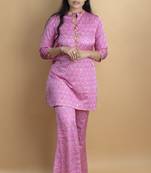 Pink co ord set with hand work embellished top and bell shaped bottoms on pure ajrakh fabric