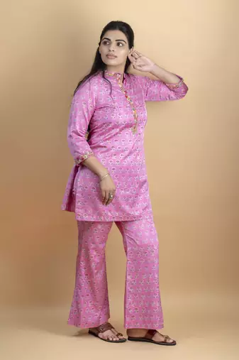 Pink co ord set with hand work embellished top and bell shaped bottoms on pure ajrakh fabric