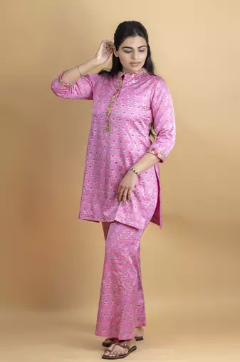 Pink co ord set with hand work embellished top and bell shaped bottoms on pure ajrakh fabric