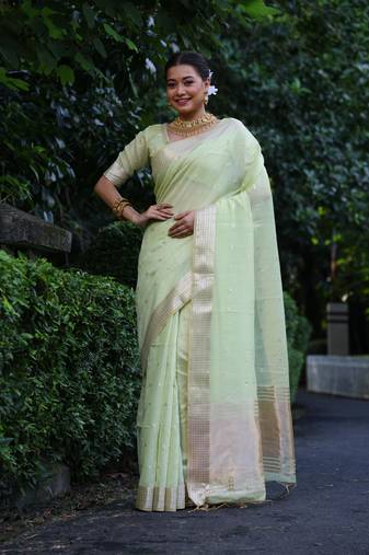 Light green tissue silk weaving saree with zari woven butties 