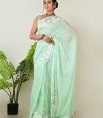 Aakar pastel green handloom cotton saree with delicate handcrafted floral art
