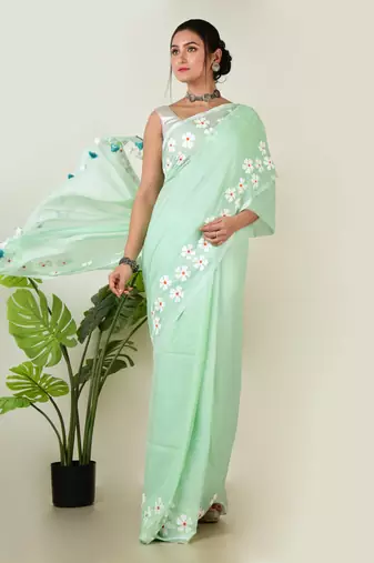 Aakar pastel green handloom cotton saree with delicate handcrafted floral art