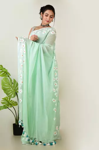 Aakar pastel green handloom cotton saree with delicate handcrafted floral art