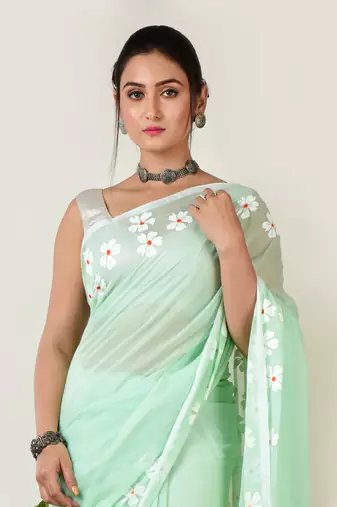 Aakar pastel green handloom cotton saree with delicate handcrafted floral art