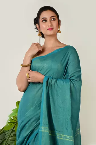 Aakar turquoise green handloom linen saree with golden zari stripe