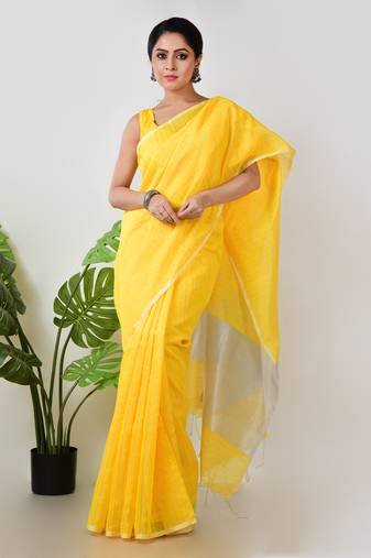 Aakar yellow handloom linen saree with white zari stripe