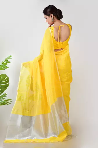 Aakar yellow handloom linen saree with white zari stripe