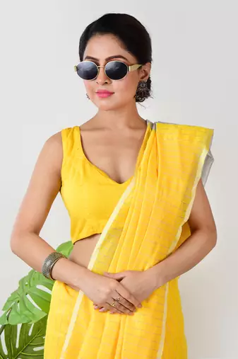 Aakar yellow handloom linen saree with white zari stripe