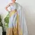 white and yellow handloom tissue saree