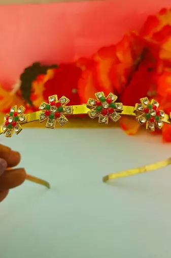Stone stud gold plated  hair band color golden material brass  size free size