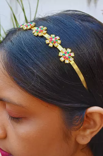 Stone stud gold plated  hair band color golden material brass  size free size
