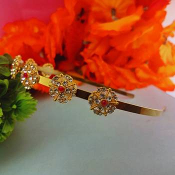 Stone stud gold plated  hair band color golden material brass  size free size 2
