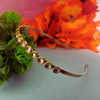 Stone stud gold plated  hair band color golden material brass  size free size 2