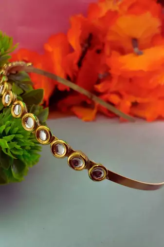 Stone stud gold plated  hair band color golden material brass  size free size