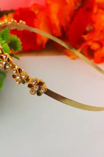 Stone stud gold plated  hair band color golden material brass  size free size