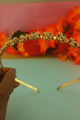 Stone stud gold plated  hair band color golden material brass  size free size