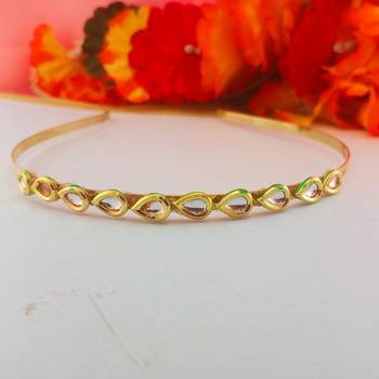 Stone stud gold plated  hair band color golden material brass  size free size 1